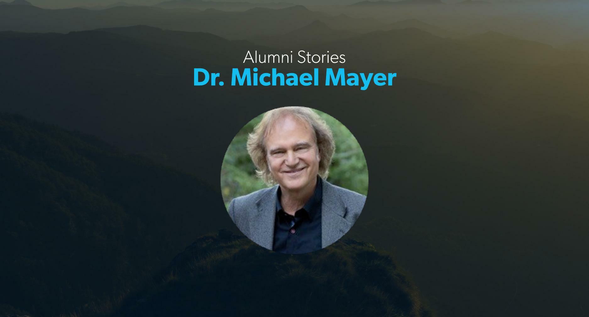 Dr. Michael Mayer smiles in a profile photo inset on a banner image under text displaying hisname.